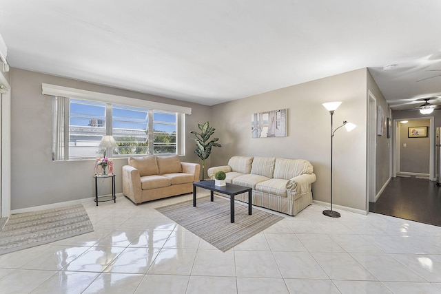 living room with light tile patterned flooring and ceiling fan