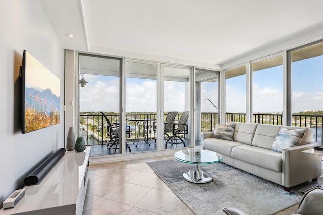 tiled living room with floor to ceiling windows