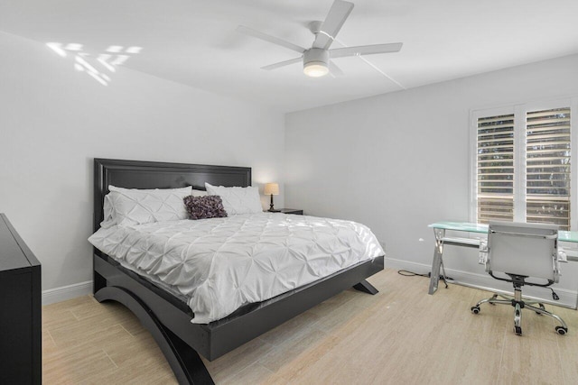 bedroom featuring ceiling fan and light wood-type flooring