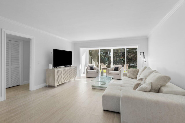 living room with crown molding and light hardwood / wood-style floors