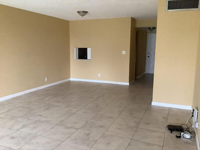 view of tiled spare room