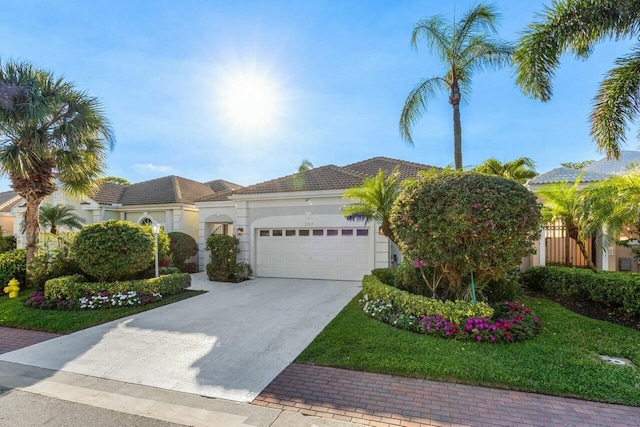 mediterranean / spanish-style home featuring a garage