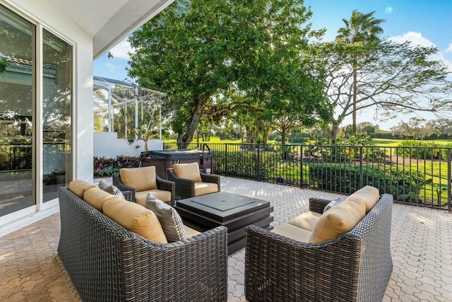 view of patio / terrace featuring a hot tub