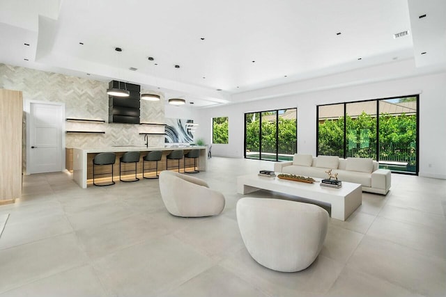 751 Pelican Way, North Palm Beach, FL 33408 - living room with a tray ceiling