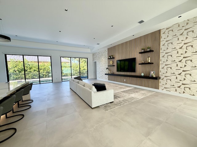 living room featuring a tray ceiling