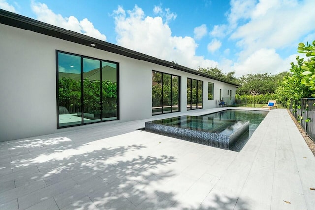 751 Pelican Way, North Palm Beach, FL 33408 - view of swimming pool with a patio and a pool with connected hot tub