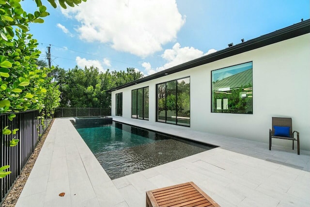 751 Pelican Way, North Palm Beach, FL 33408 - view of pool with a fenced backyard, a patio, and a pool with connected hot tub
