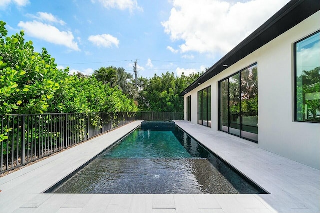 751 Pelican Way, North Palm Beach, FL 33408 - view of swimming pool with fence and a pool with connected hot tub