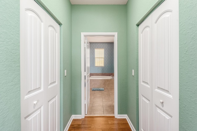 hallway featuring wood-type flooring