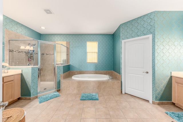 bathroom featuring vanity, tile patterned floors, and shower with separate bathtub