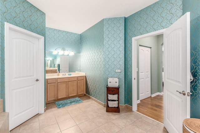 bathroom with tile patterned flooring and vanity