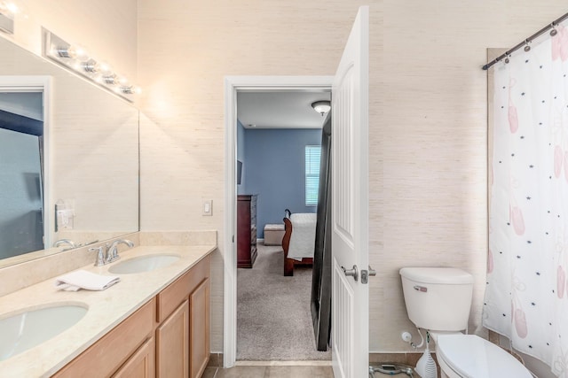 bathroom with walk in shower, vanity, and toilet