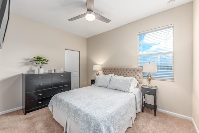 carpeted bedroom with ceiling fan