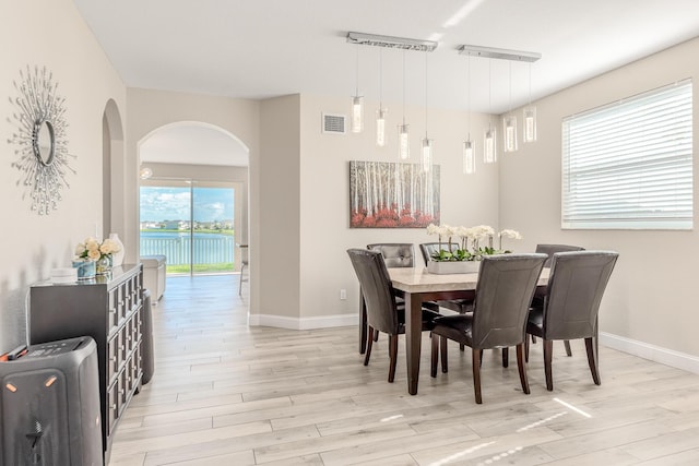 dining area with light hardwood / wood-style floors