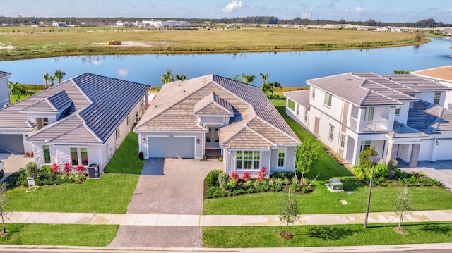 birds eye view of property featuring a water view