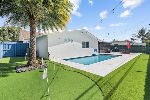 view of swimming pool with a patio and a lawn