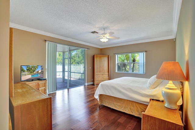 bedroom with crown molding, access to exterior, and hardwood / wood-style flooring