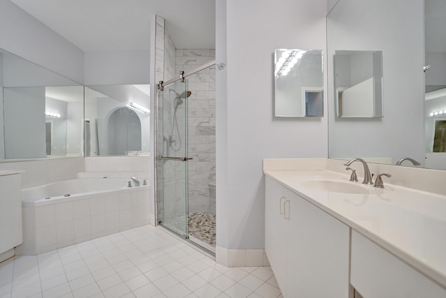 bathroom with independent shower and bath, vanity, and tile patterned floors