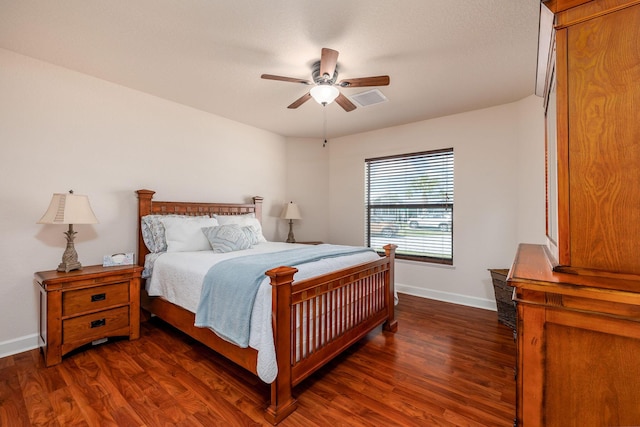 bedroom with ceiling fan and dark hardwood / wood-style flooring