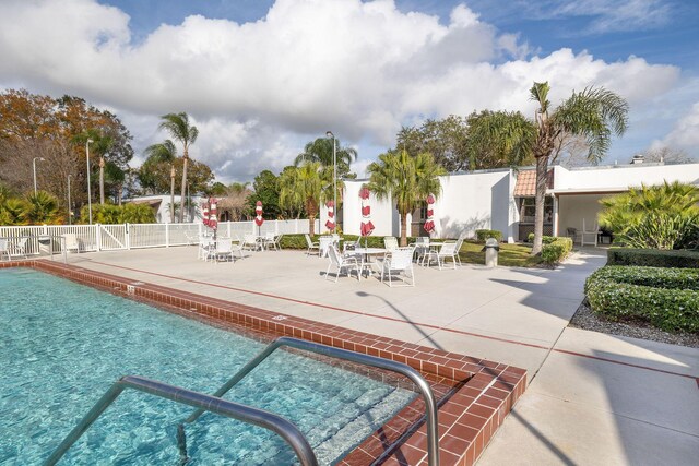 view of swimming pool featuring a patio area