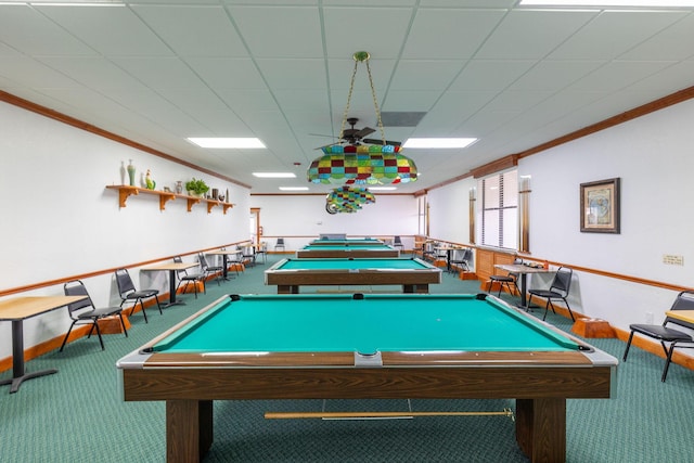 game room with ceiling fan, ornamental molding, and carpet