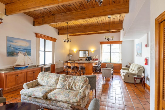 living room featuring light tile patterned floors, wooden ceiling, and a chandelier