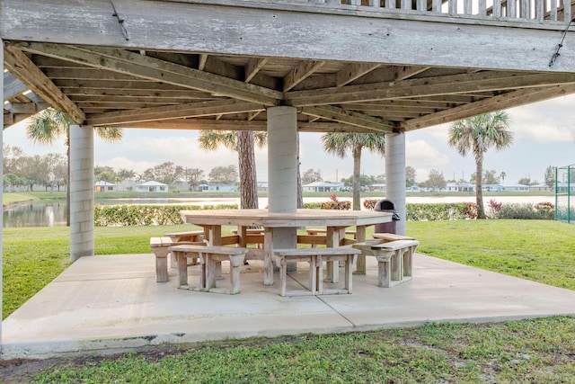 view of patio with a water view