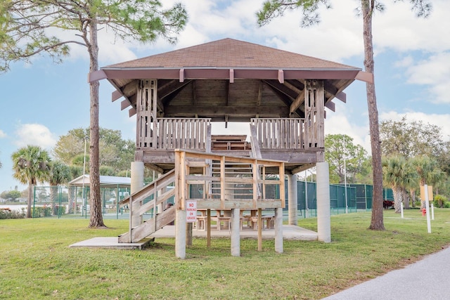 exterior space with a yard and a playground