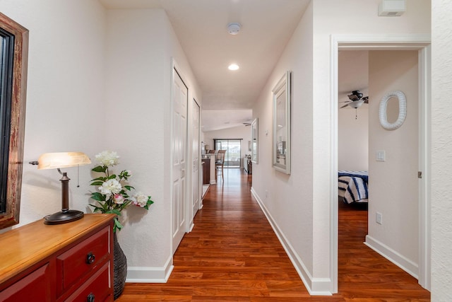 hallway featuring dark hardwood / wood-style floors