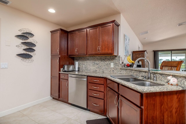 kitchen with light stone counters, sink, backsplash, and stainless steel dishwasher