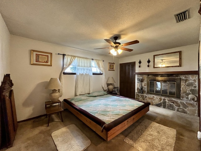 600 NW 344th St, Okeechobee, FL 34972 - carpeted bedroom with ceiling fan, a textured ceiling, and a fireplace