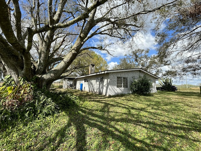 600 NW 344th St, Okeechobee, FL 34972 - view of home's exterior with a lawn