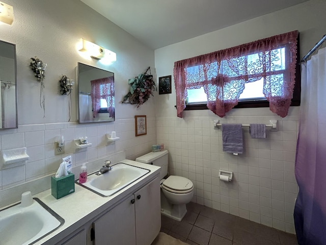 600 NW 344th St, Okeechobee, FL 34972 - bathroom with vanity, tile patterned floors, tile walls, and toilet