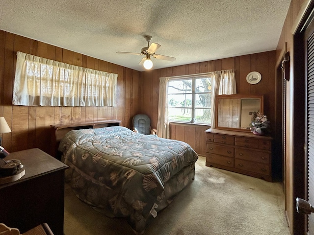 600 NW 344th St, Okeechobee, FL 34972 - carpeted bedroom featuring ceiling fan, wooden walls, and a textured ceiling