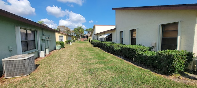 view of yard with central air condition unit