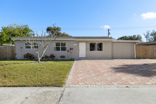 single story home with a patio area and a front lawn