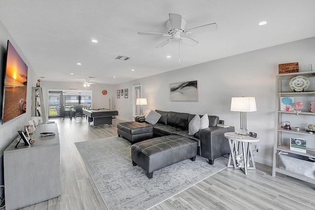 living room with ceiling fan, billiards, and light hardwood / wood-style flooring