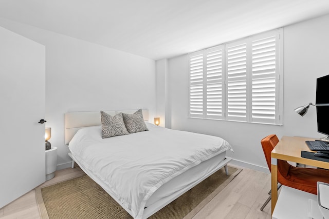 bedroom with light hardwood / wood-style floors