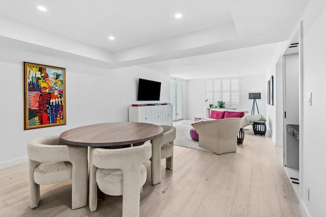 dining space with light wood-type flooring