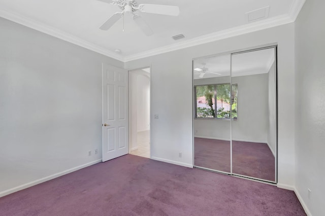 unfurnished bedroom featuring ornamental molding, carpet flooring, visible vents, and baseboards