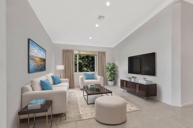 living room with lofted ceiling, visible vents, recessed lighting, and light tile patterned floors