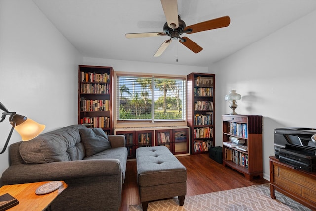 living room with lofted ceiling, hardwood / wood-style floors, and ceiling fan