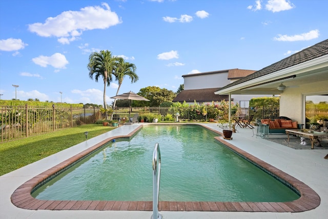 view of swimming pool with ceiling fan, outdoor lounge area, and a patio