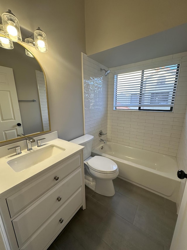 full bathroom with tiled shower / bath combo, vanity, tile patterned floors, and toilet