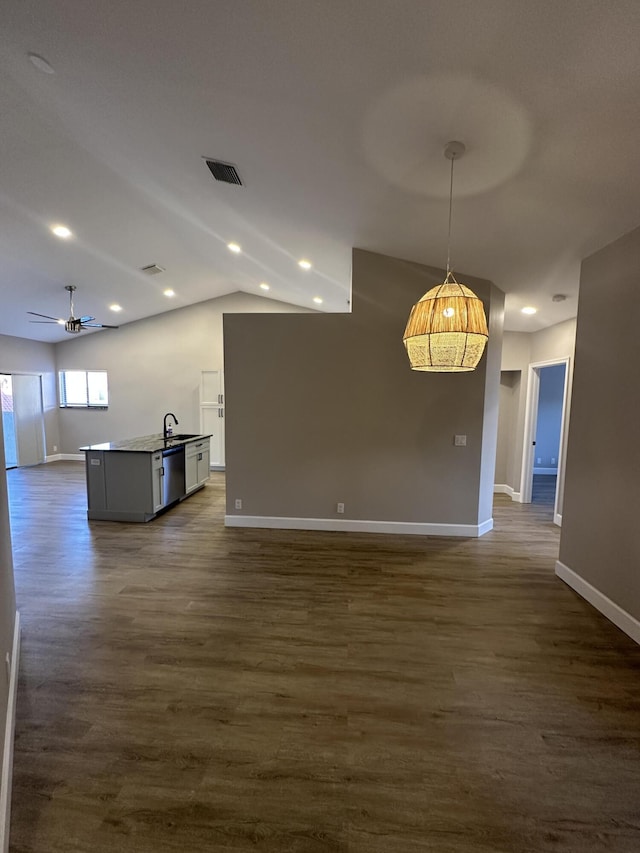 interior space featuring lofted ceiling, dark hardwood / wood-style floors, and ceiling fan