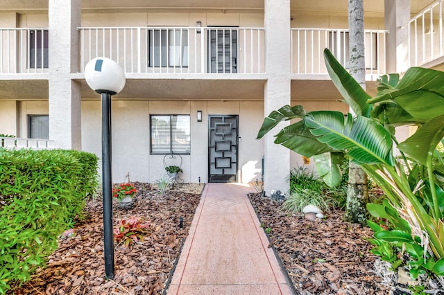 property entrance featuring stucco siding