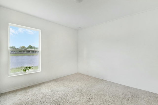 empty room featuring a water view