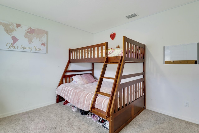 bedroom with light carpet, visible vents, and baseboards