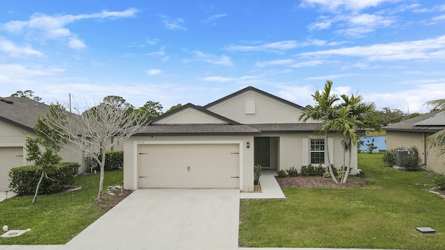 ranch-style home with a garage, concrete driveway, and a front yard