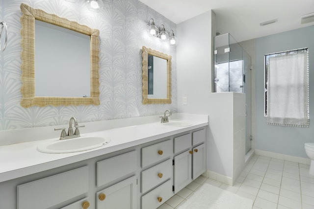 bathroom featuring vanity, an enclosed shower, tile patterned floors, and toilet